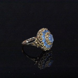 Bague d'occasion en or jaune ornée d'aigue-marine