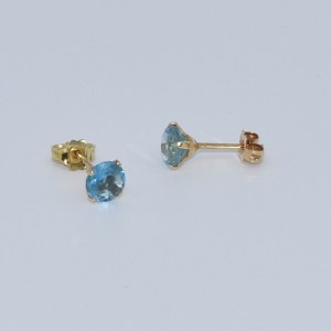 Boucles d'oreilles or jaune serties de pierre bleue